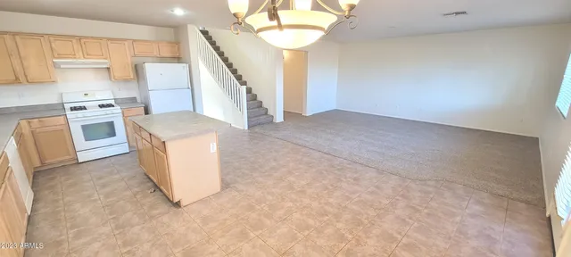 a view of kitchen with furniture and wooden floor