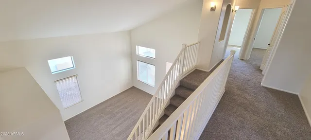 a view of a hallway with windows