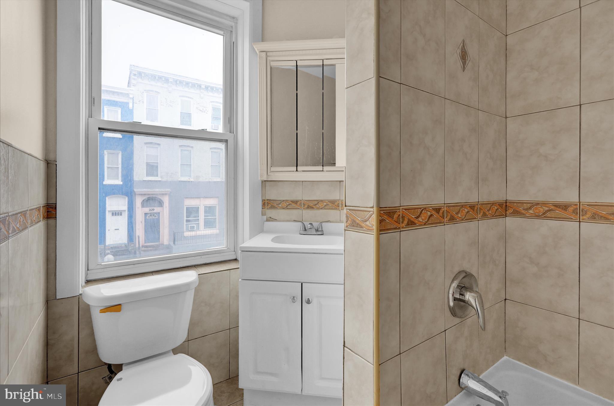 230 South 4th Street Reading, PA 19602 - Photo 11 of 26 a bathroom with a sink toilet and shower