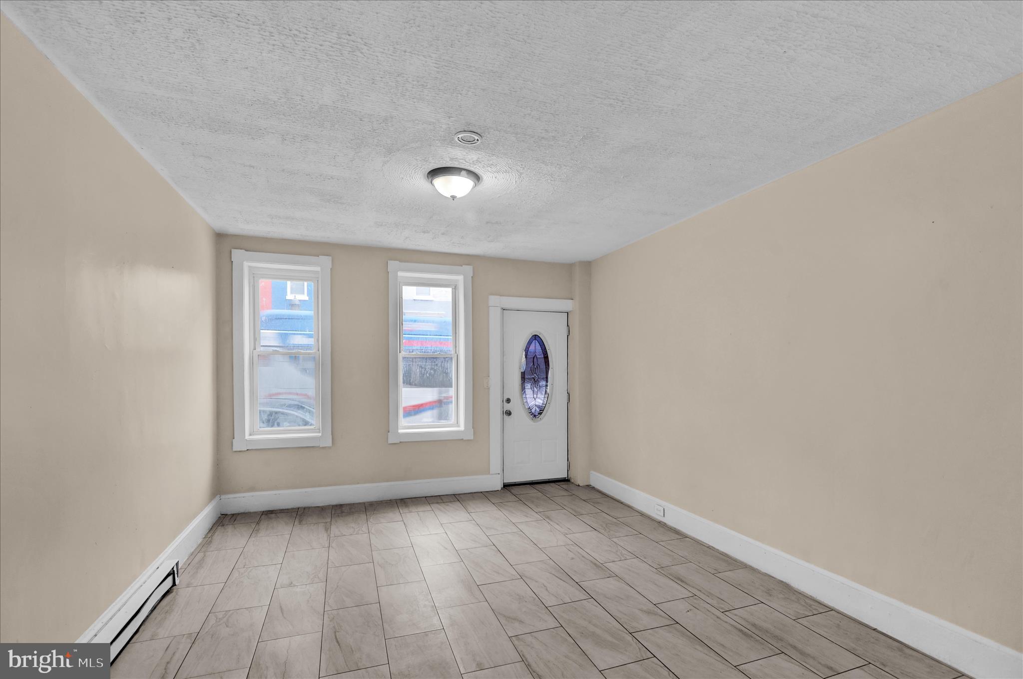 230 South 4th Street Reading, PA 19602 - Photo 2 of 26 an empty room with windows