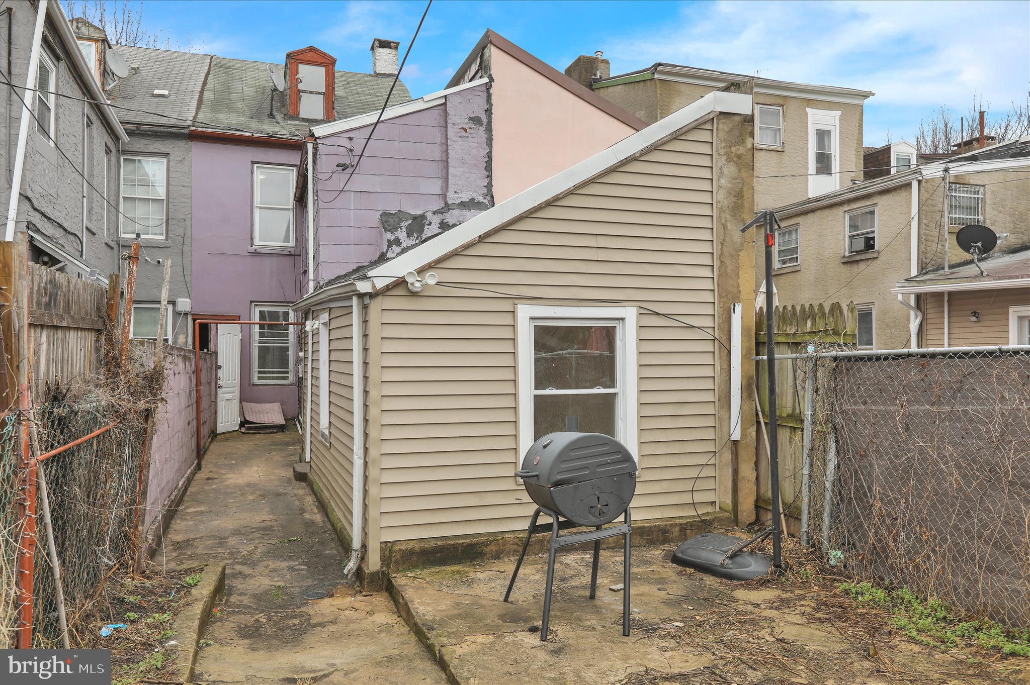 230 South 4th Street Reading, PA 19602 - Photo 24 of 26 a view of backyard with a chair and potted plant