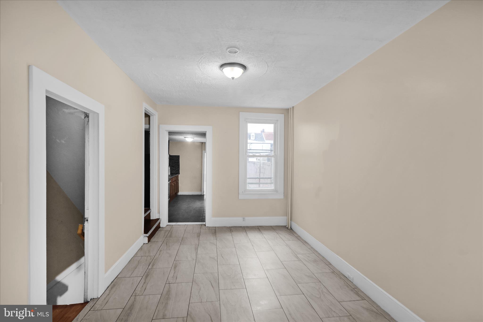 230 South 4th Street Reading, PA 19602 - Photo 4 of 26 wooden floor in an empty room with a window