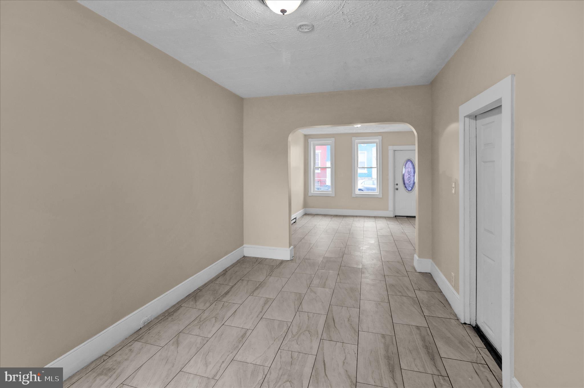 230 South 4th Street Reading, PA 19602 - Photo 5 of 26 wooden floor in a room with a window