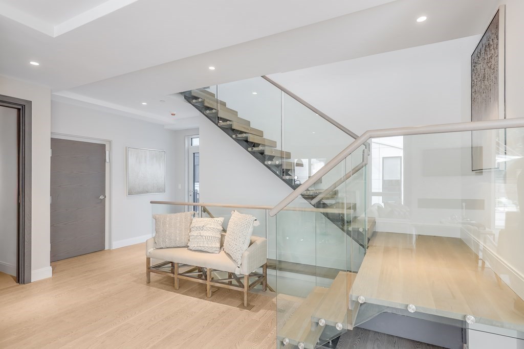 75 Westbourne Terrace, Unit 75 Brookline, MA 02446 - Photo 13 of 31 a view of entryway and hall with wooden floor