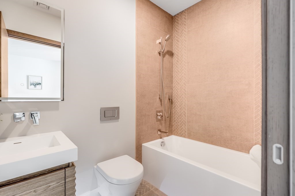 75 Westbourne Terrace, Unit 75 Brookline, MA 02446 - Photo 23 of 31 a bathroom with a sink a toilet and shower