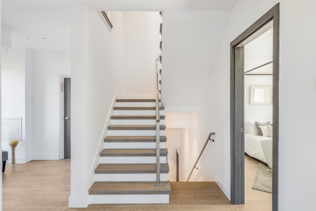 75 Westbourne Terrace, Unit 75 Brookline, MA 02446 - Photo 24 of 31 a view of entryway and hall with wooden floor