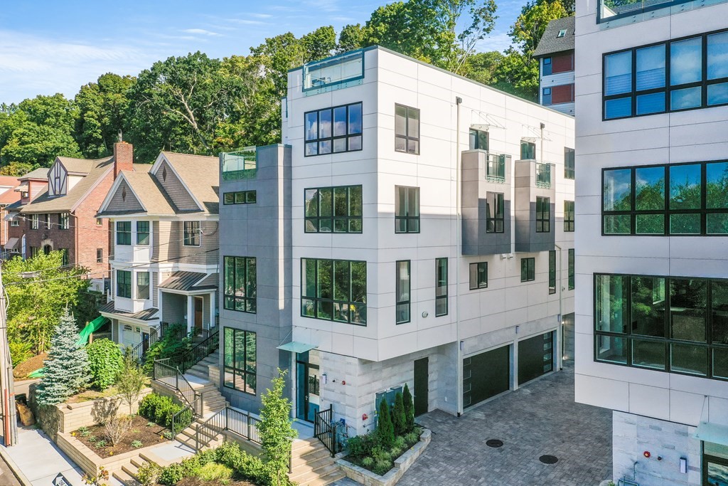 75 Westbourne Terrace, Unit 75 Brookline, MA 02446 - Photo 31 of 31 a view of a white building among the street