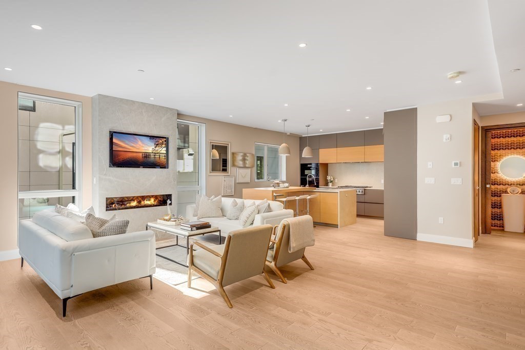 75 Westbourne Terrace, Unit 75 Brookline, MA 02446 - Photo 5 of 31 a living room with furniture white walls and kitchen view