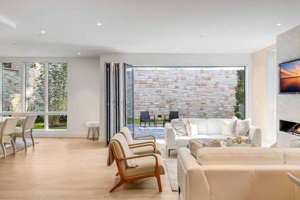 75 Westbourne Terrace, Unit 75 Brookline, MA 02446 - Photo 6 of 31 a living room with furniture and a large window