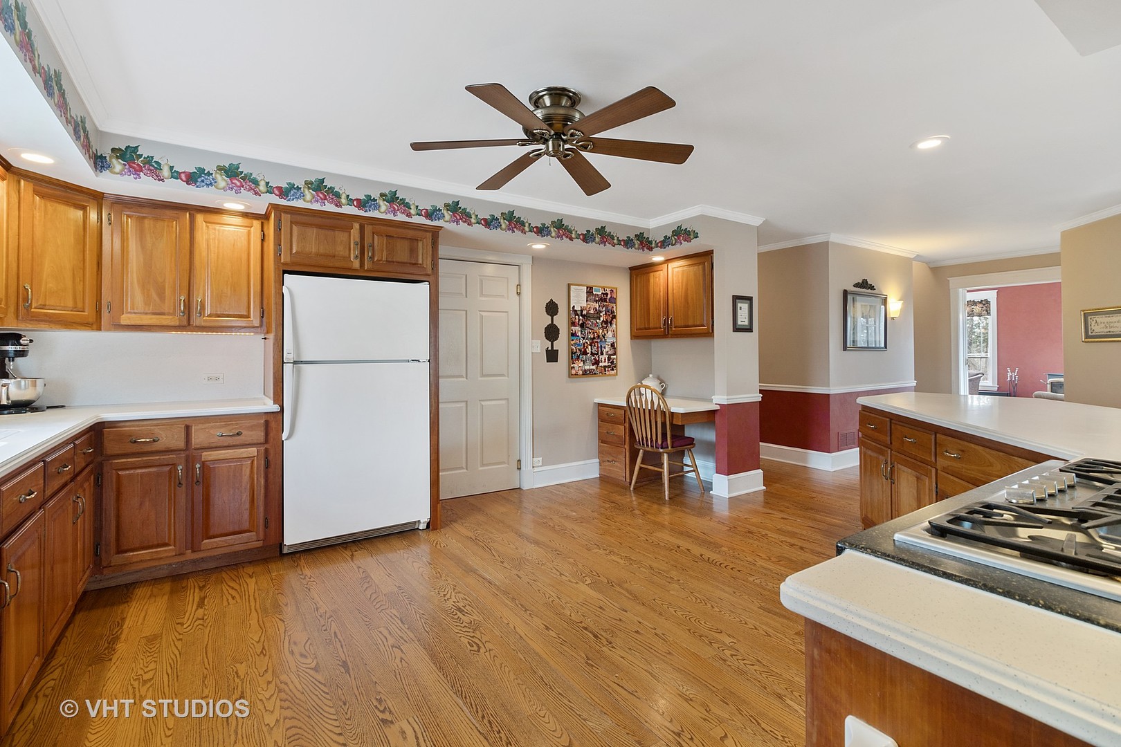 5509 Pagles Road Harvard, IL 60033 - Photo 8 of 26 a kitchen with stainless steel appliances granite countertop a refrigerator a stove a sink dishwasher and white countertops with wooden floor