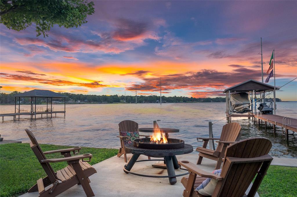309 Shore Line Drive Tool, TX 75143 - Photo 20 of 23 a view of a lake with table and chairs