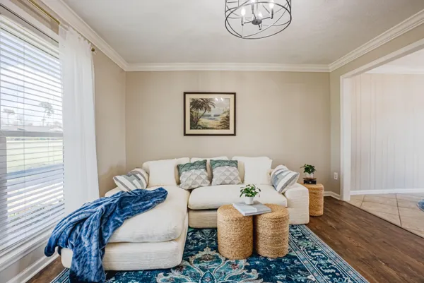 a living room with furniture and a window