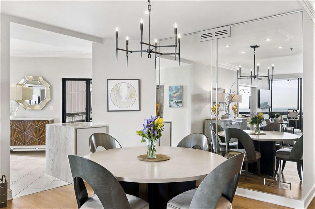 2660 Peachtree Road Northwest, Unit 34F Atlanta, GA 30305 - Photo 4 of 57 a view of a dining room with furniture