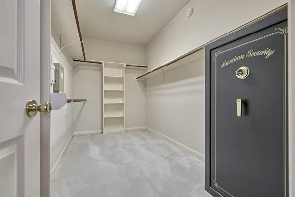 a utility room with cabinets washer and dryer