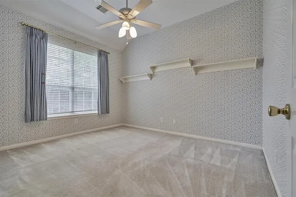 a view of house with backyard