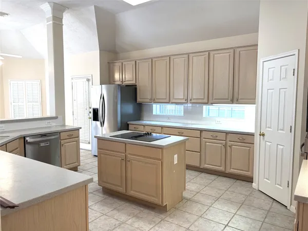 a bathroom with a granite countertop sink double vanity and a bathtub