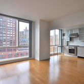 a view of a kitchen with granite countertop a stove and a large window