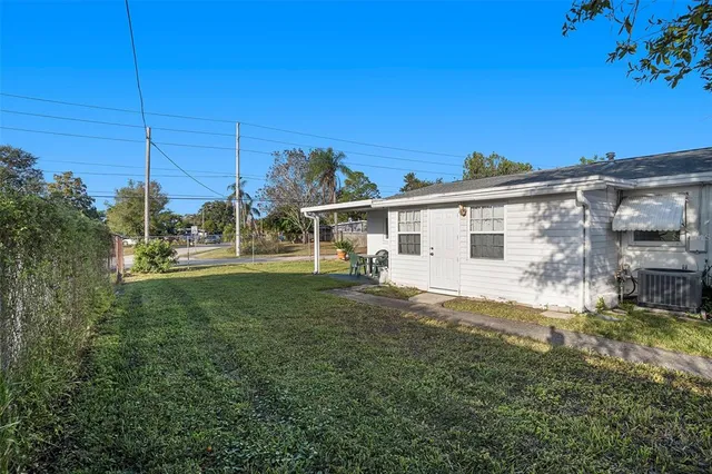 a view of a house with a big yard