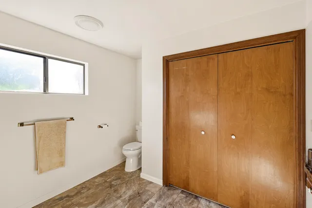 a bathroom with a shower toilet and sink
