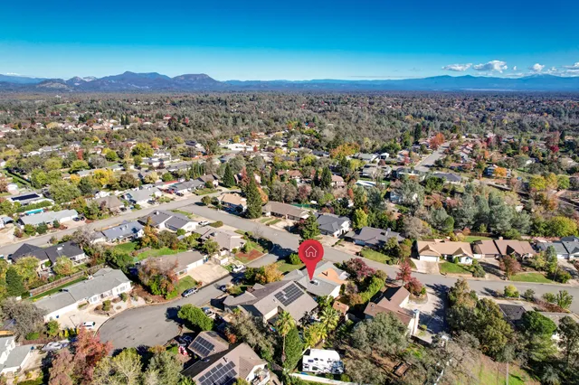 an aerial view of house with yard
