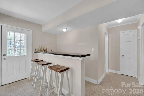 a bedroom with a bed and cabinets