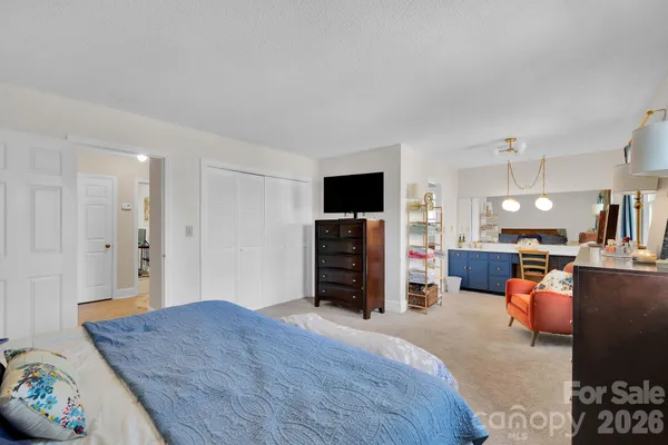a bedroom with furniture and a couch