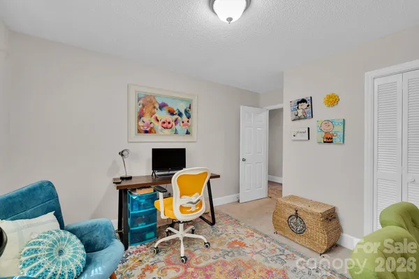 a bedroom with a bed and furniture