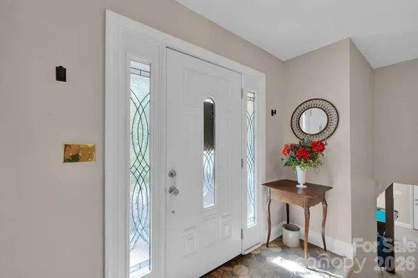 a room with furniture and a mirror