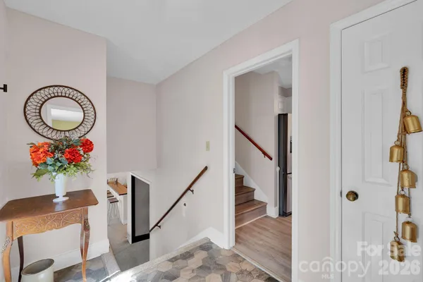 a view of entryway with wooden floor