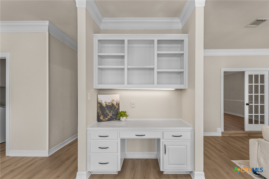 5901 Round Table Cove Austin, TX 78746 - Photo 13 of 46 a view of white cabinets and wooden floor