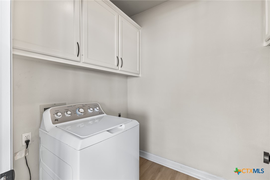 5901 Round Table Cove Austin, TX 78746 - Photo 21 of 46 a utility room with dryer and washer