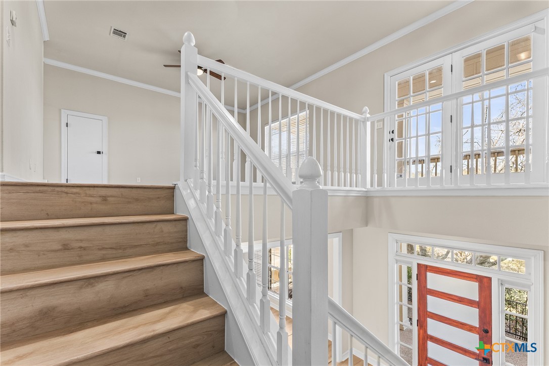 5901 Round Table Cove Austin, TX 78746 - Photo 24 of 46 a view of entryway and hall with wooden floor