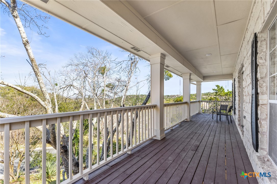 5901 Round Table Cove Austin, TX 78746 - Photo 27 of 46 a view of balcony with wooden floor