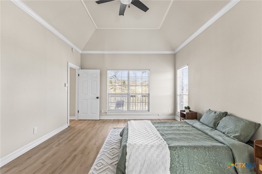 5901 Round Table Cove Austin, TX 78746 - Photo 29 of 46 a bedroom with a bed and a large window