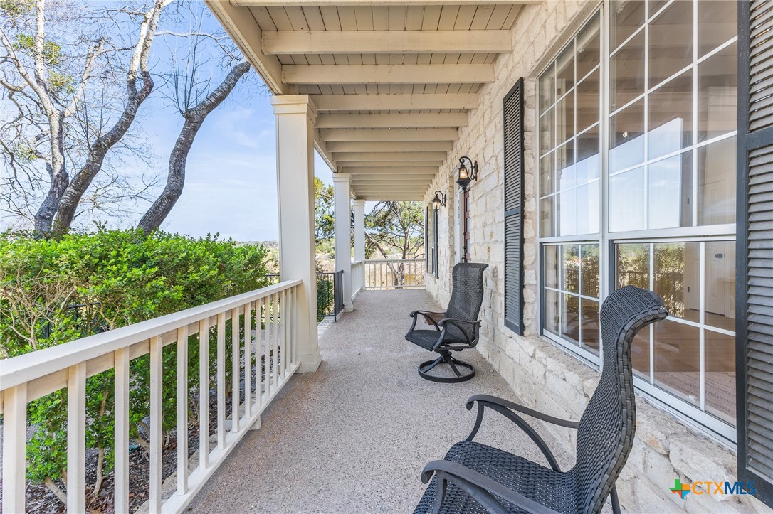 5901 Round Table Cove Austin, TX 78746 - Photo 3 of 46 a view of porch with seating space