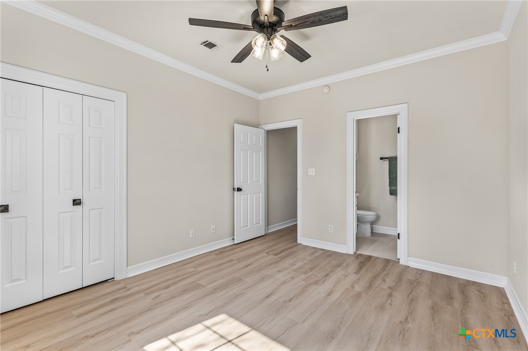 5901 Round Table Cove Austin, TX 78746 - Photo 36 of 46 wooden floor in an empty room with a window