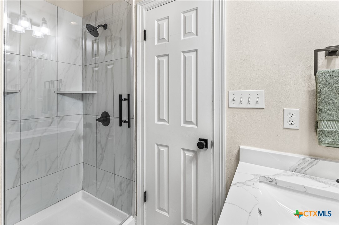 5901 Round Table Cove Austin, TX 78746 - Photo 38 of 46 a bathroom with a shower