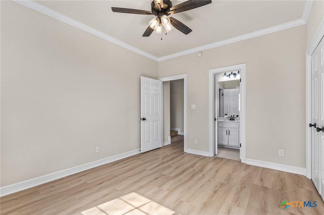 5901 Round Table Cove Austin, TX 78746 - Photo 40 of 46 a view of an empty room and chandelier fan