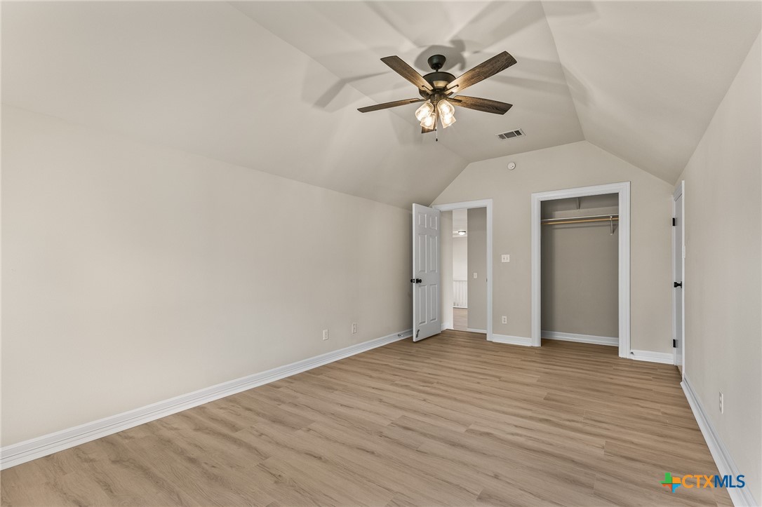 5901 Round Table Cove Austin, TX 78746 - Photo 43 of 46 wooden floor in an empty room