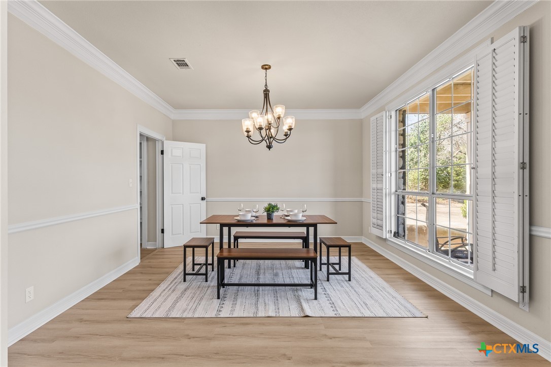 5901 Round Table Cove Austin, TX 78746 - Photo 6 of 46 a living room with furniture and a wooden floor