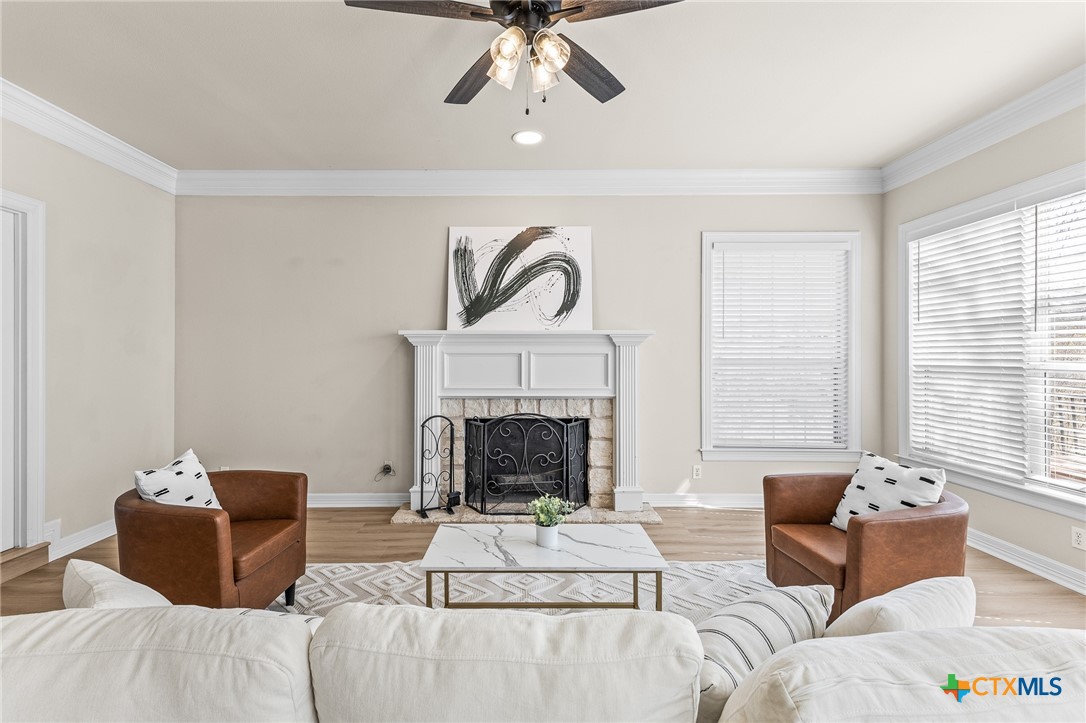 5901 Round Table Cove Austin, TX 78746 - Photo 9 of 46 a living room with furniture and a fireplace