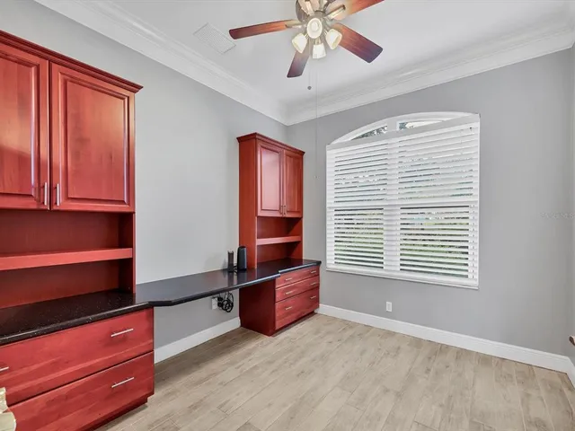 a room with window and ceiling fan