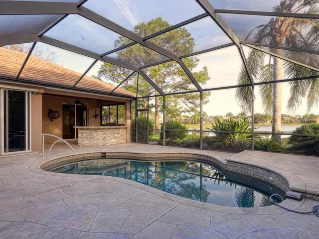 a view of roof deck with couch and chairs