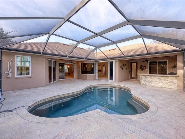 a view of patio with table and chairs