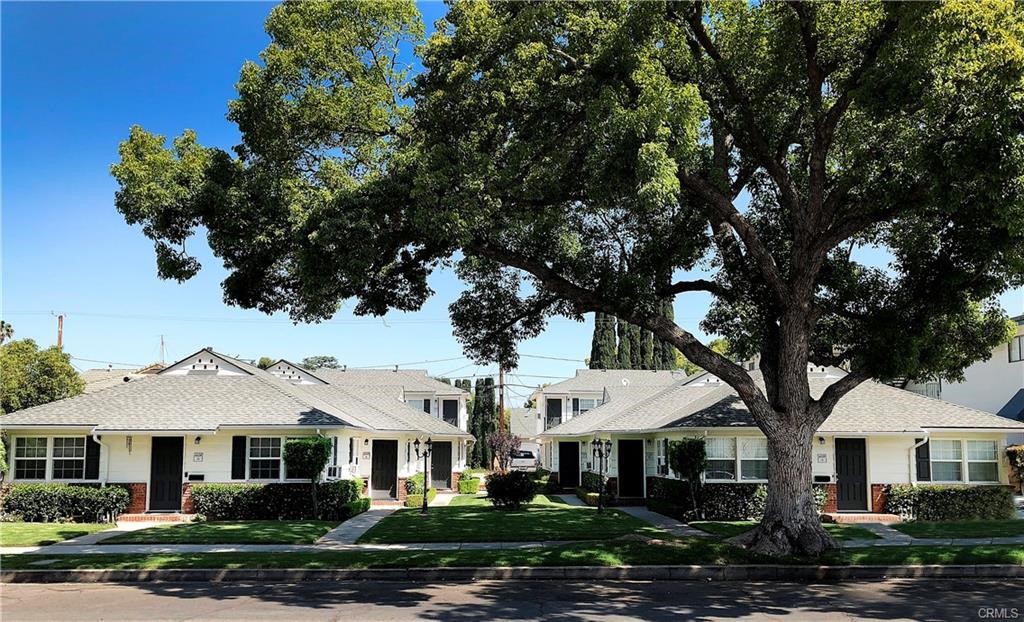 4137 1/2 Warner Boulevard Burbank, CA 91505 - Photo 1 of 14 a front view of a residential houses with yard and green space