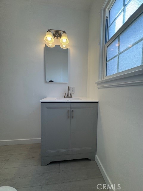 4137 1/2 Warner Boulevard Burbank, CA 91505 - Photo 11 of 14 a bathroom with a sink and a mirror