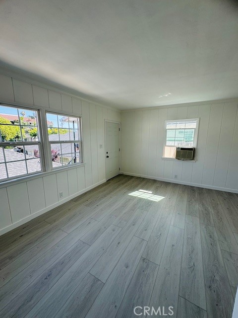 4137 1/2 Warner Boulevard Burbank, CA 91505 - Photo 5 of 14 an empty room with wooden floor and windows