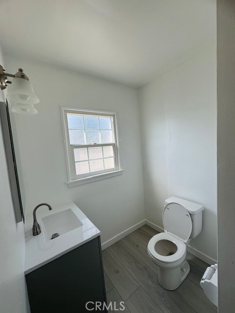 4137 1/2 Warner Boulevard Burbank, CA 91505 - Photo 10 of 14 a bathroom with a toilet sink and window