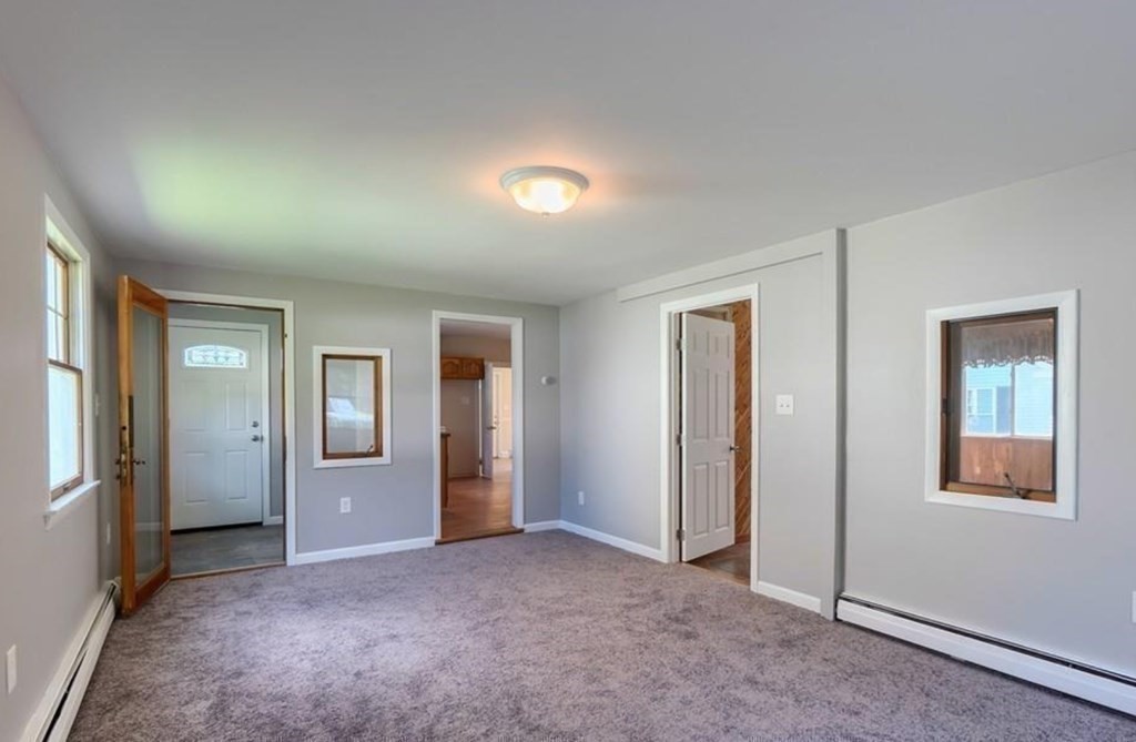142 East Meadow Road Lowell, MA 01854 - Photo 7 of 28 wooden floor and windows in a room