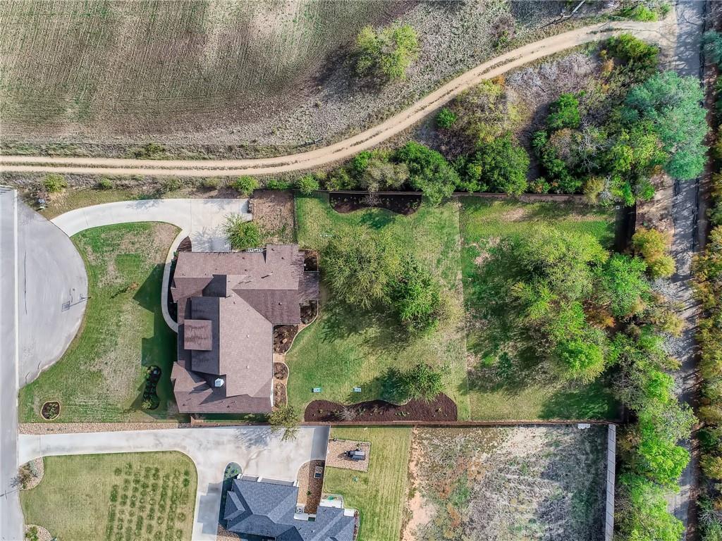 132 Huerta Road Florence, TX 76527 - Photo 36 of 40 An aerial perspective reveals a private cul-de-sac residence nestled amongst mature trees and expansive green space.